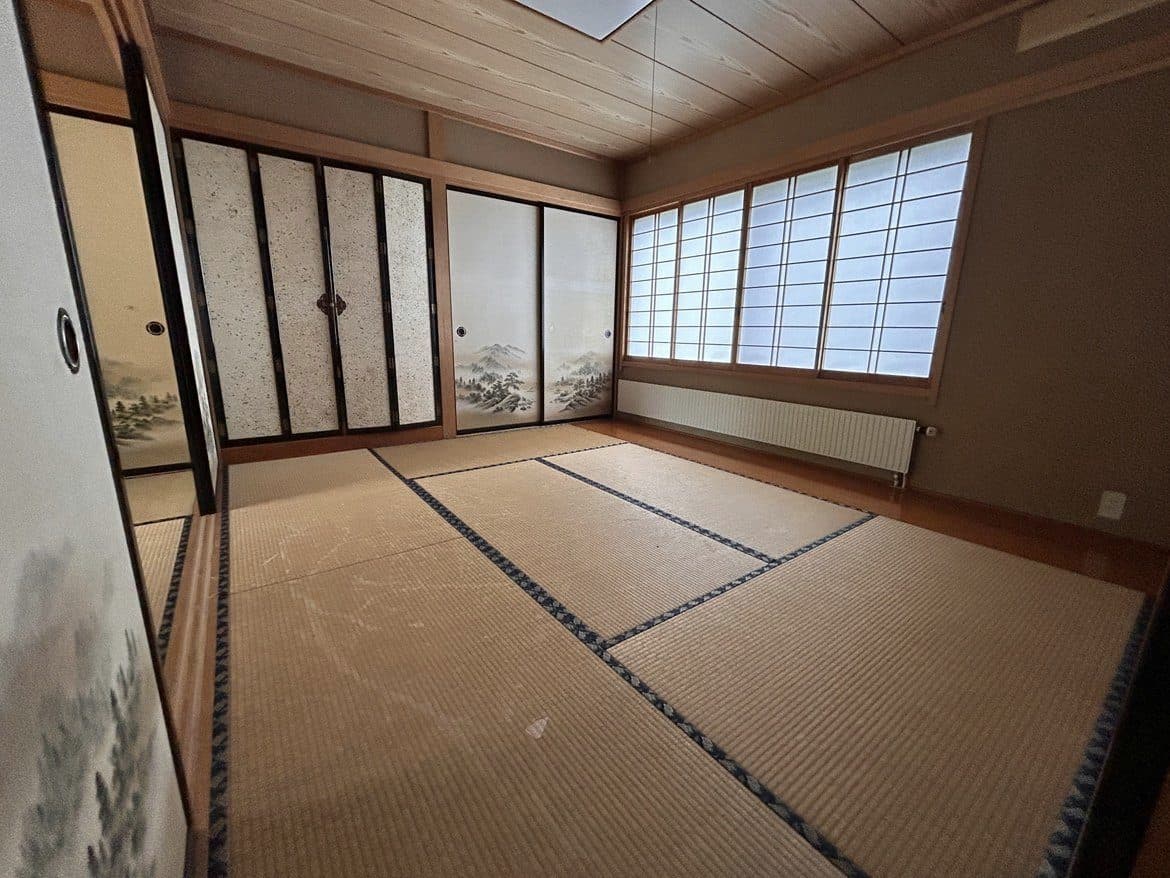 A tatami room in the Shinanomachi home as it is today, before renovation, with paper sliding doors